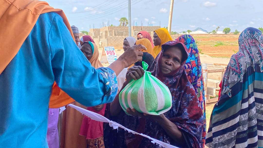 Elderly woman receiving aid