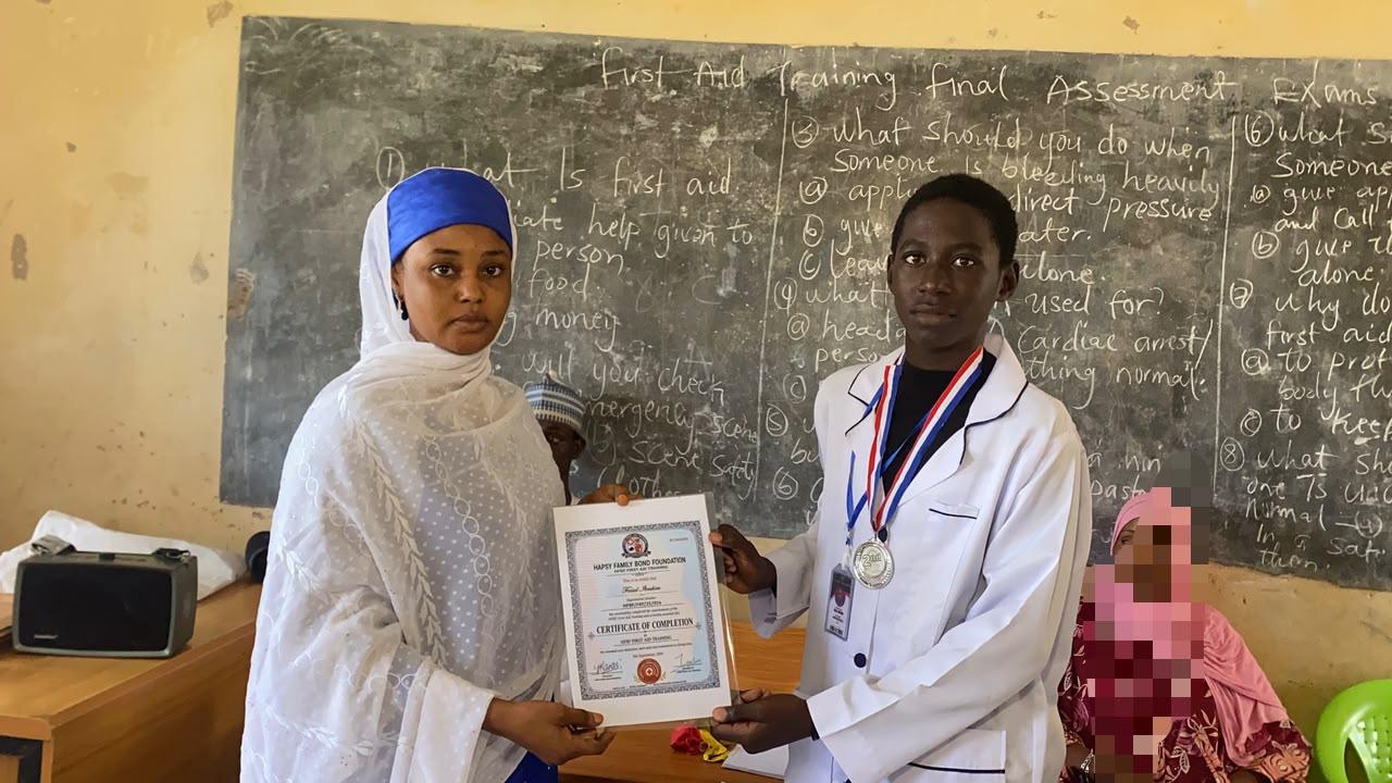 Young trainee receiving certificate