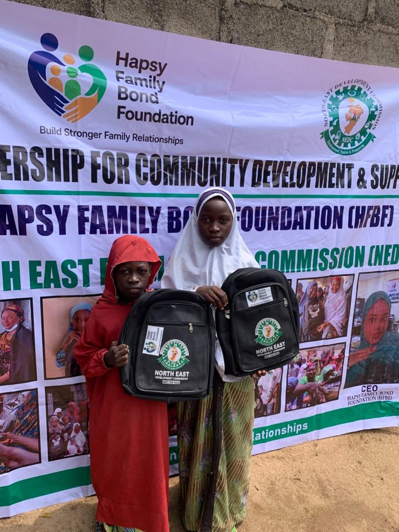 Children with NEDC backpacks